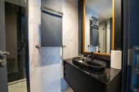 a bathroom with a sink and a mirror at Superior, classy residence,7&#47;24 Security,2 bedroom ( Benesta 205 ) in Istanbul
