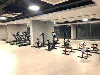 a gym with a bunch of treadms and cardio machines at Superior, classy residence,7&#47;24 Security,2 bedroom ( Benesta 205 ) in Istanbul