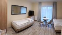 Postel nebo postele na pokoji v ubytování Lazur Apartamenty