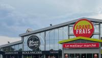 a large building with several signs on it at Cocon Accès facile Parking Gratuit in Belfort