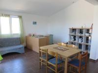 a kitchen and dining room with a table and chairs at Apartments with a parking space Bibinje, Zadar - 5753 in Bibinje