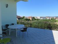 a balcony with a table and chairs and a view at Apartments with a parking space Bibinje, Zadar - 5753 in Bibinje