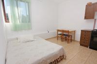 a bedroom with a bed and a table and a desk at Apartments with a parking space Bibinje, Zadar - 5753 in Bibinje