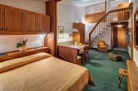 Posteľ alebo postele v izbe v ubytovaní Hotel Cristallino d'Ampezzo