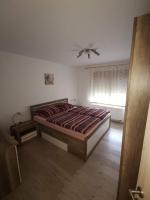 Posteľ alebo postele v izbe v ubytovaní Apartmani G&E