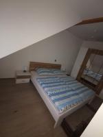 Posteľ alebo postele v izbe v ubytovaní Apartmani G&E