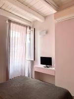 Televízia a/alebo spoločenská miestnosť v ubytovaní L'angolo di mare [Centro di Sirolo]