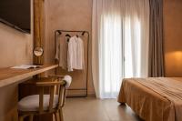 Postel nebo postele na pokoji v ubytování Opuntia Suites