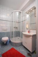 a bathroom with a shower and a toilet and a sink at Apartments with a parking space Sveti Petar, Biograd - 6169 in Sveti Petar