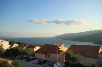a view of a town with houses and the ocean at Apartments with a parking space Rabac, Labin - 7442 in Rabac