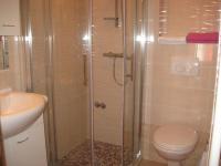a bathroom with a shower with a toilet and a sink at Apartments with a parking space Rabac, Labin - 7442 in Rabac