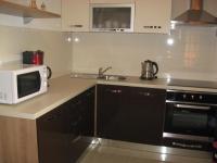 a kitchen with a microwave and a sink at Apartments with a parking space Rabac, Labin - 7442 in Rabac