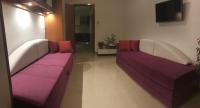 a living room with two white and purple couches at Apartments with a parking space Rabac, Labin - 7442 in Rabac