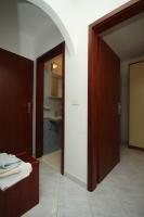 an open door to a room with a bathroom at Apartments with a parking space Rabac, Labin - 7442 in Rabac