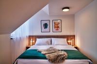 Posteľ alebo postele v izbe v ubytovaní Urpí­n City Residence