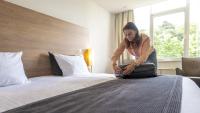 Ein Bett oder Betten in einem Zimmer der Unterkunft Sanadome Hotel & Spa Nijmegen