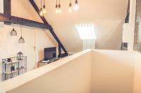 Televízia a/alebo spoločenská miestnosť v ubytovaní Le loft superbe studio avec stationnement gratuit