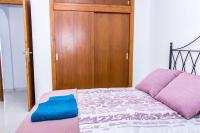 Posteľ alebo postele v izbe v ubytovaní Villa El Arenal a 3 min de la Playa