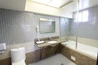 a bathroom with a toilet and a sink and a tub at Bay of Stars in Ji&#39;an