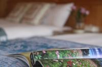 a close up of a book on a bed at Bay of Stars in Ji&#39;an