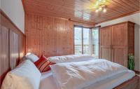 A bed or beds in a room at Großes Ferienhaus St, Gallenk,