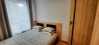 Posteľ alebo postele v izbe v ubytovaní Asti Apartamenty Centrum Stargard