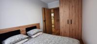 Posteľ alebo postele v izbe v ubytovaní Asti Apartamenty Centrum Stargard
