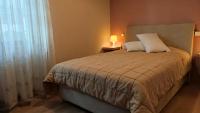 A bed or beds in a room at Vasileiou Apartments