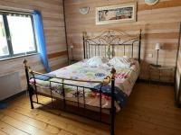 Łóżko lub łóżka w pokoju w obiekcie Chalet 8-10 personnes sur la station des Rousses
