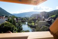 a view from a window of a town with a river at Studio Loft Murau - im Herzen der Altstadt in Murau