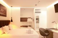 Postel nebo postele na pokoji v ubytování Woohoo Rooms Boutique Sol