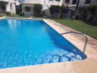 Bazén v ubytování Apartamento Urb Oasis Park II Denia, las Marinas nebo v jeho okolí