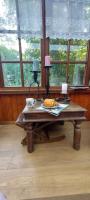 a wooden table in a room with a table with at &#39;T boshuisje in Opglabbeek