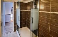 a shower with a glass door in a bathroom at 2 Bedroom Lovely Home In Plogoff in Plogoff