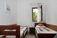Posteľ alebo postele v izbe v ubytovaní Apartments by the sea Trogir - 11895