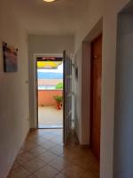 a hallway with a door leading to a patio at Apartment Nenadic in Hrahorić