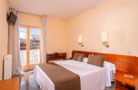 A bed or beds in a room at Hotel Guitart Rosa - Adults Only