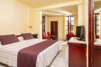 A television and/or entertainment centre at Hotel Guitart Rosa - Adults Only