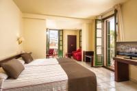 A bed or beds in a room at Hotel Guitart Rosa - Adults Only