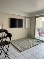 Televízia a/alebo spoločenská miestnosť v ubytovaní Appartement à 50 mètres de la Plage des Estagnots à Seignosse, Landes