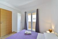 Posteľ alebo postele v izbe v ubytovaní Apartment Nin 13172c