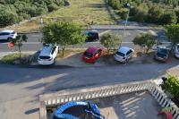 an aerial view of a parking lot with cars parked at Apartments with a parking space Grebastica, Sibenik - 13365 in Bašelovići