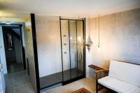 a shower with a glass door in a room at Résidence Le Lenn-louannec - Maisons &amp; Villas pour 6 Personnes 784 in Lannion