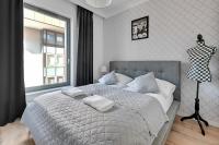 Posteľ alebo postele v izbe v ubytovaní Grand Apartments - Brabank Apartments