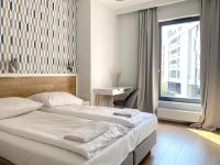 Posteľ alebo postele v izbe v ubytovaní Grand Apartments - Brabank Apartments