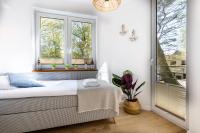 Posteľ alebo postele v izbe v ubytovaní APARTAMENT 20B BLUE MARINE Poddąbie Basen Odkryty Brodziki Plac Zabaw dwie sypialnie