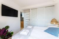 Posteľ alebo postele v izbe v ubytovaní APARTAMENT 20B BLUE MARINE Poddąbie Basen Odkryty Brodziki Plac Zabaw dwie sypialnie