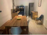 a kitchen with a wooden dining table and chairs at Deux Alpes - Résidence aux pieds des pistes -8 pers in Les Deux Alpes