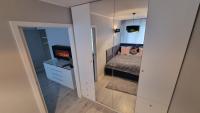 Posteľ alebo postele v izbe v ubytovaní Apartament ZACISZE