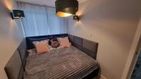 Posteľ alebo postele v izbe v ubytovaní Apartament ZACISZE